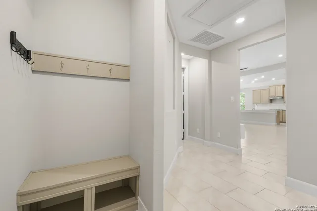 a backyard of a house with a fountain and a lake view