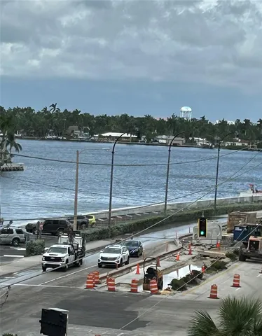 a view of parking with cars and parked