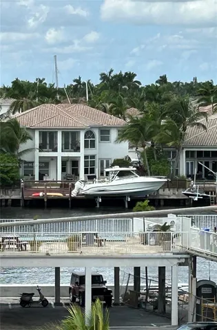 a front view of a building with glass windows and a table