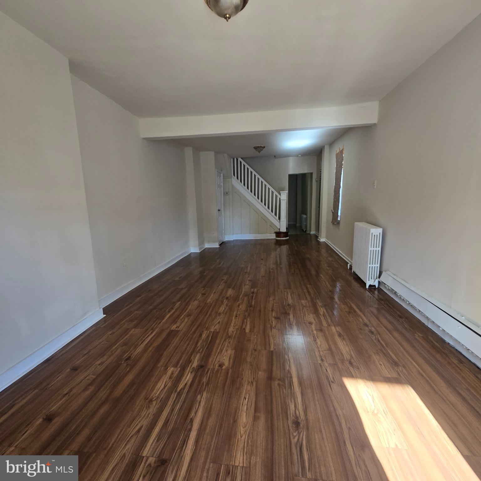 1681 Meadow Street Philadelphia, PA 19124 - Photo 2 of 3 a view of empty room with wooden floor