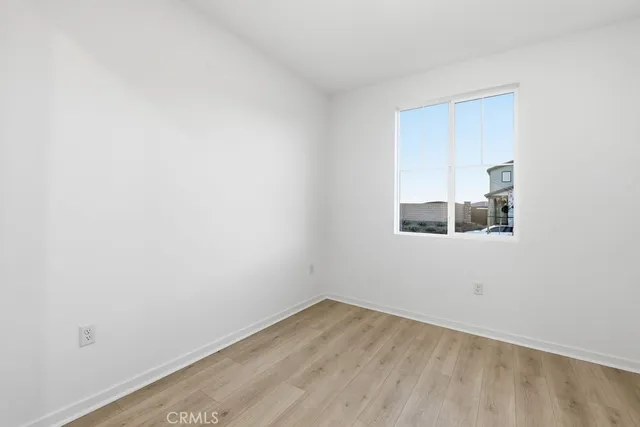 a view of large kitchen with stainless steel appliances kitchen island a sink and a refrigerator