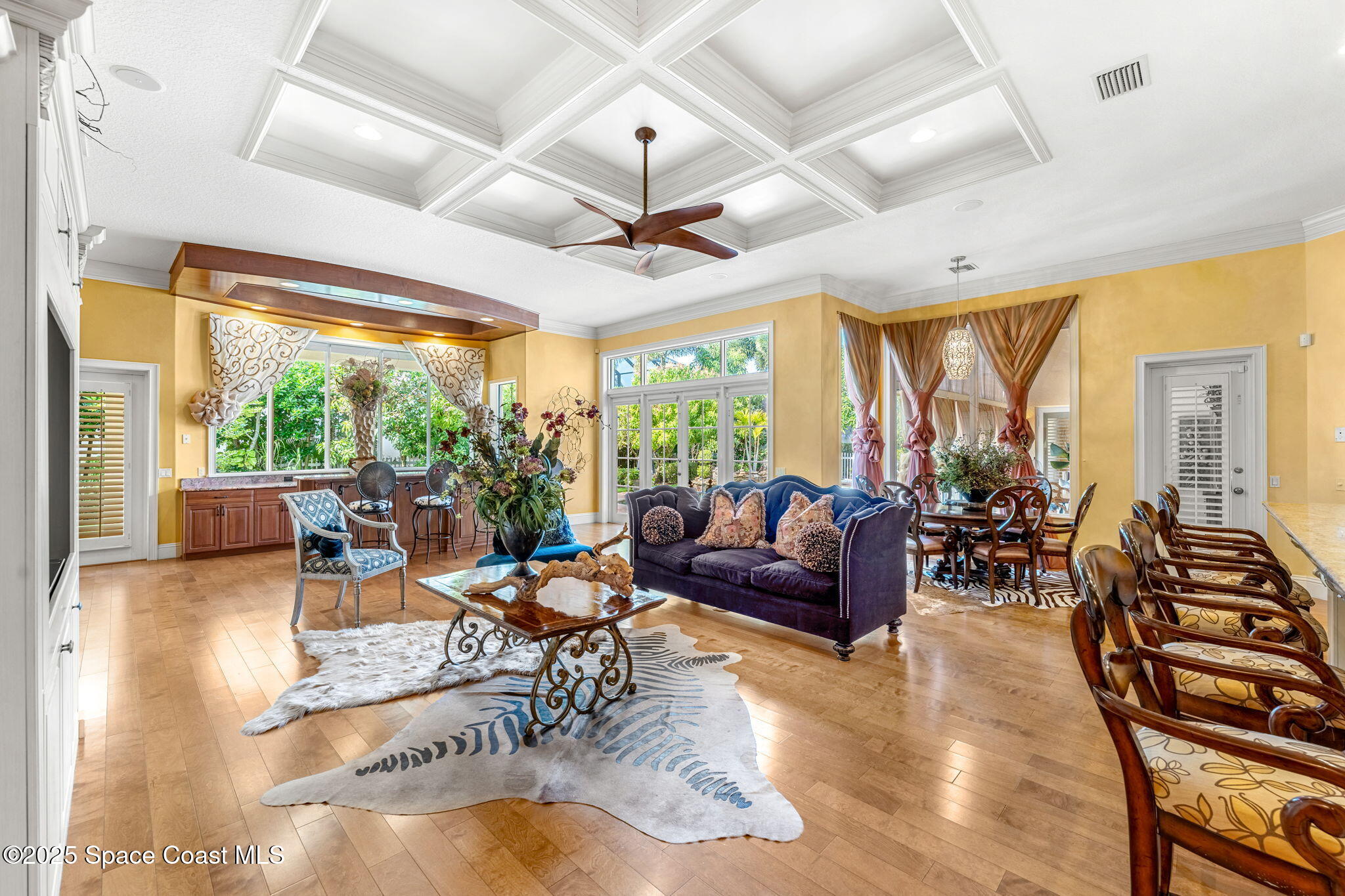 3738 Cappio Drive Melbourne, FL 32940 - Photo 11 of 62 a living room with lots of furniture and a large window