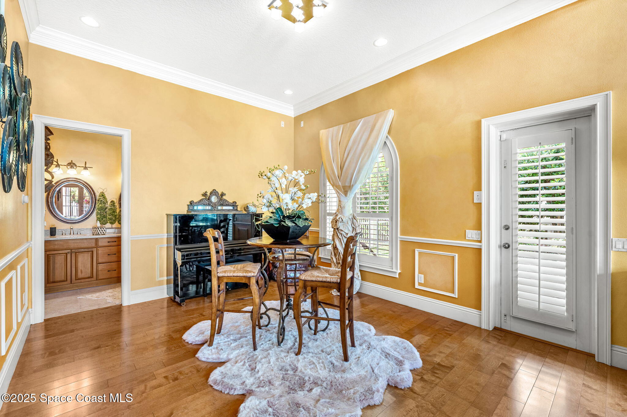 3738 Cappio Drive Melbourne, FL 32940 - Photo 16 of 62 a dining room with furniture and wooden floor
