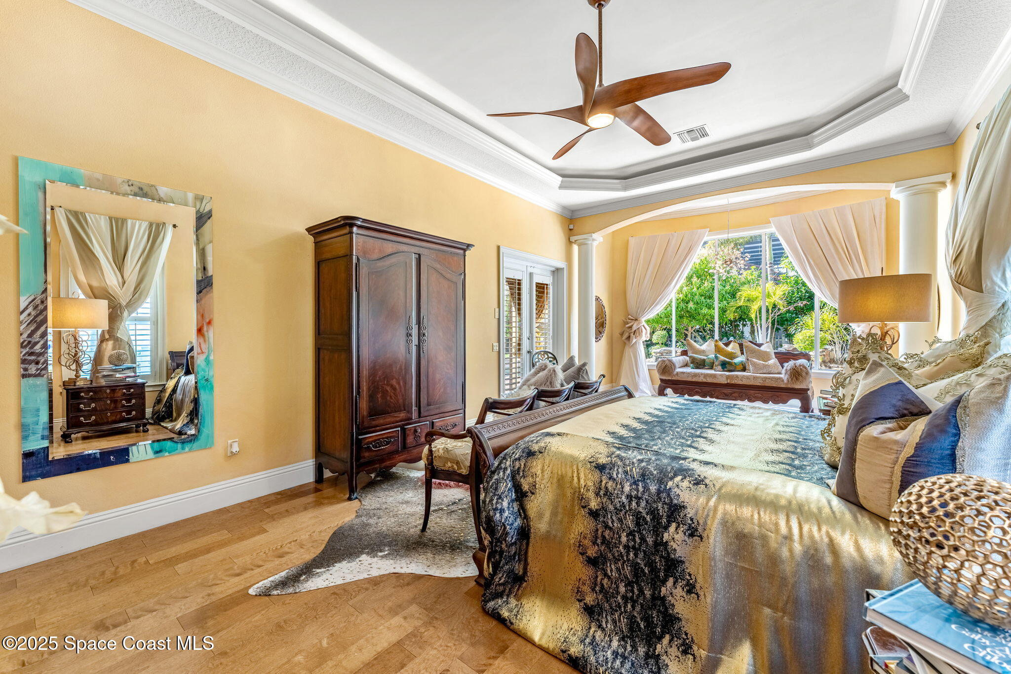 3738 Cappio Drive Melbourne, FL 32940 - Photo 17 of 62 a bed sitting in a bedroom next to a window