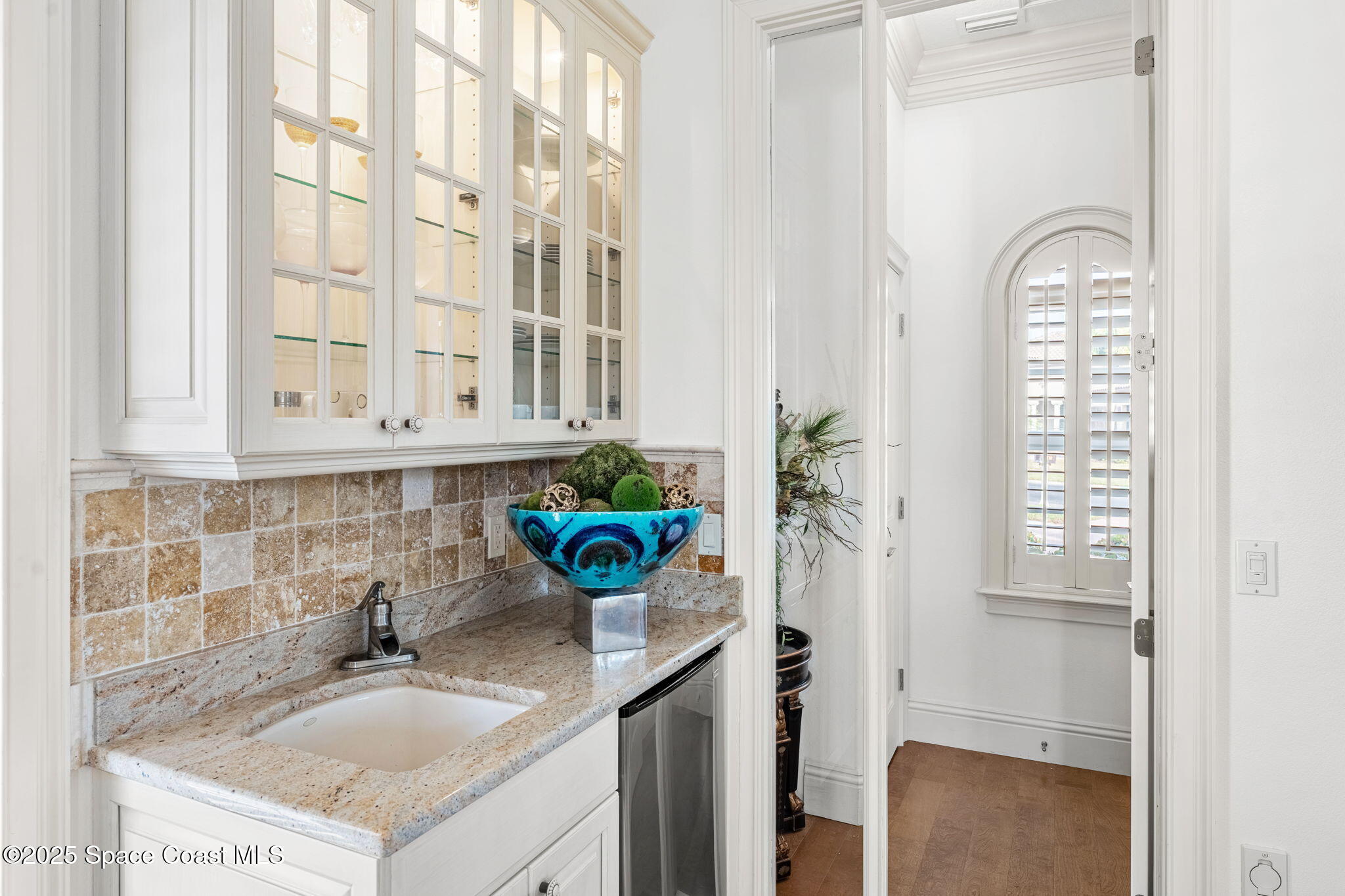3738 Cappio Drive Melbourne, FL 32940 - Photo 30 of 62 a bathroom with a granite countertop sink a toilet and a shower