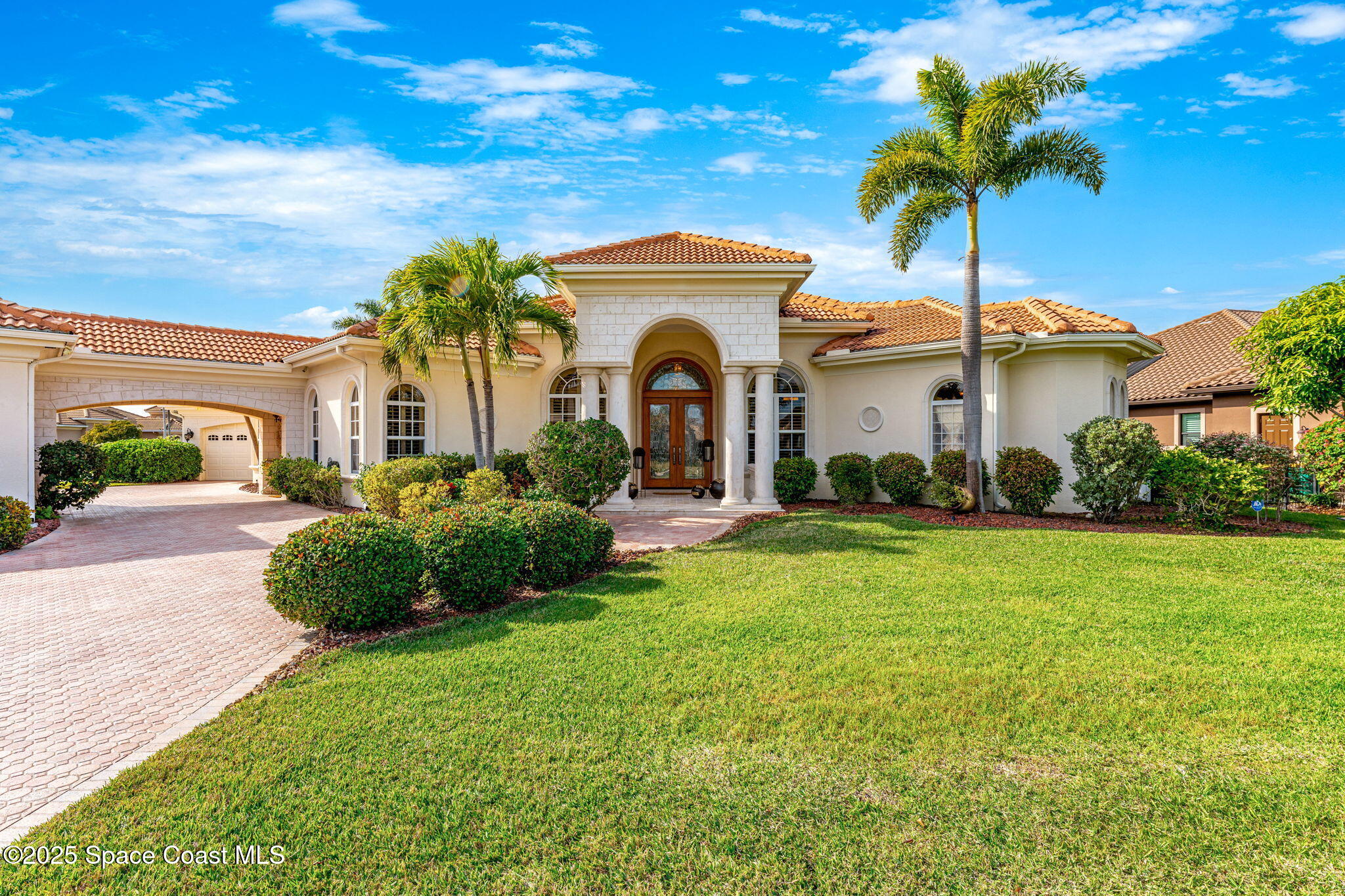3738 Cappio Drive Melbourne, FL 32940 - Photo 3 of 62 a front view of a house with a garden
