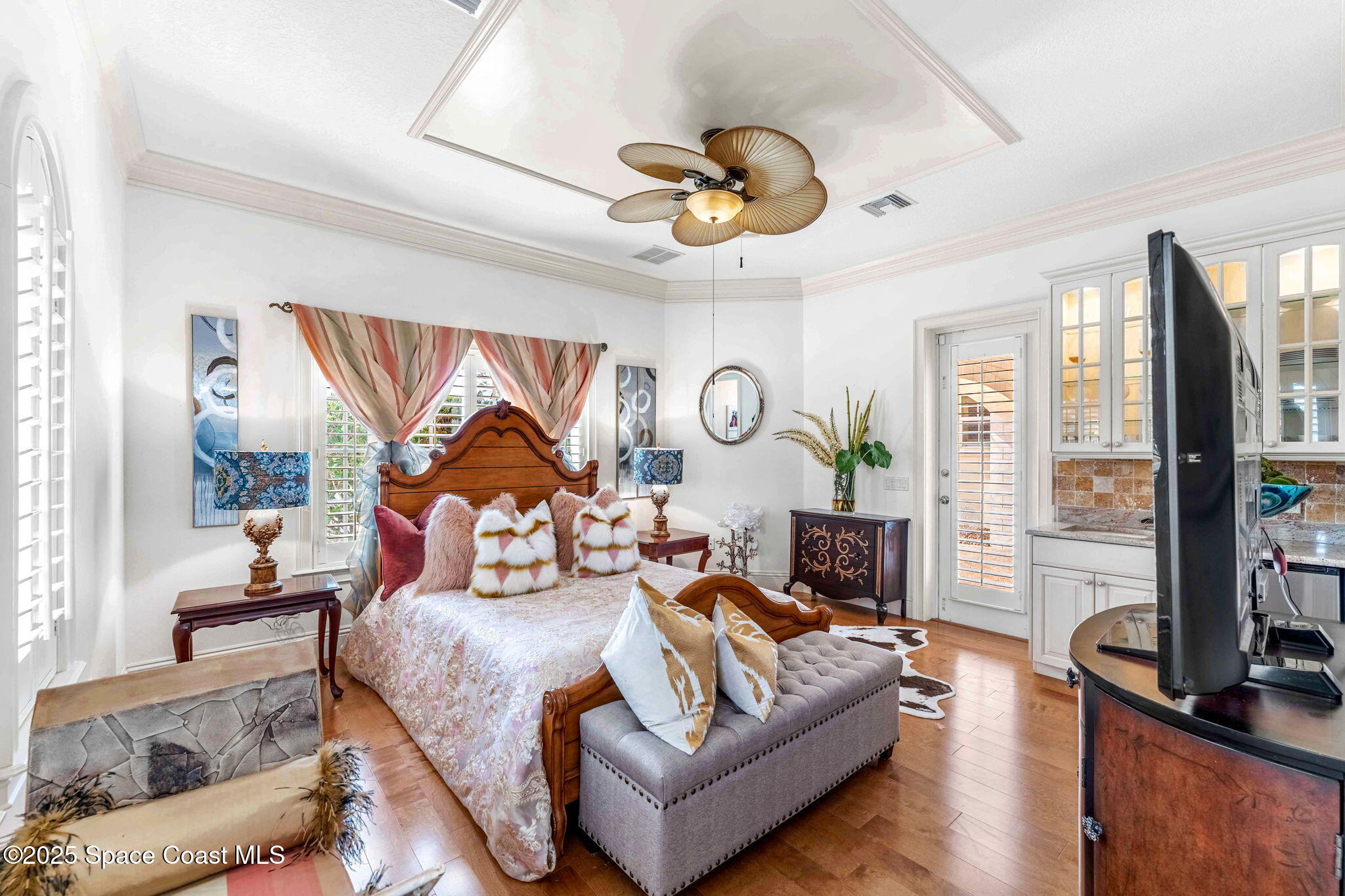 3738 Cappio Drive Melbourne, FL 32940 - Photo 38 of 62 a bedroom with a bed and a large window