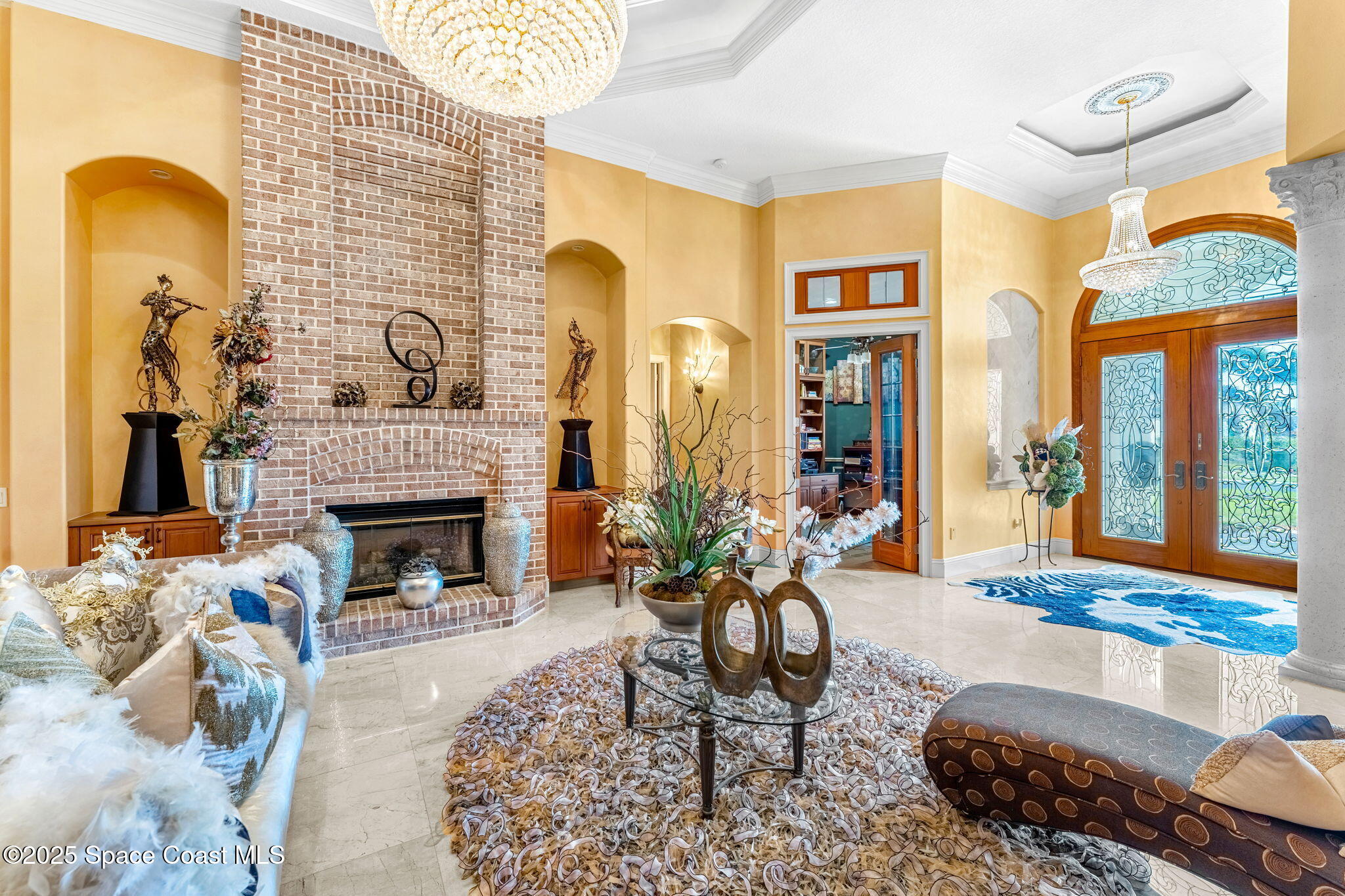 3738 Cappio Drive Melbourne, FL 32940 - Photo 4 of 62 a living room with furniture and a fireplace