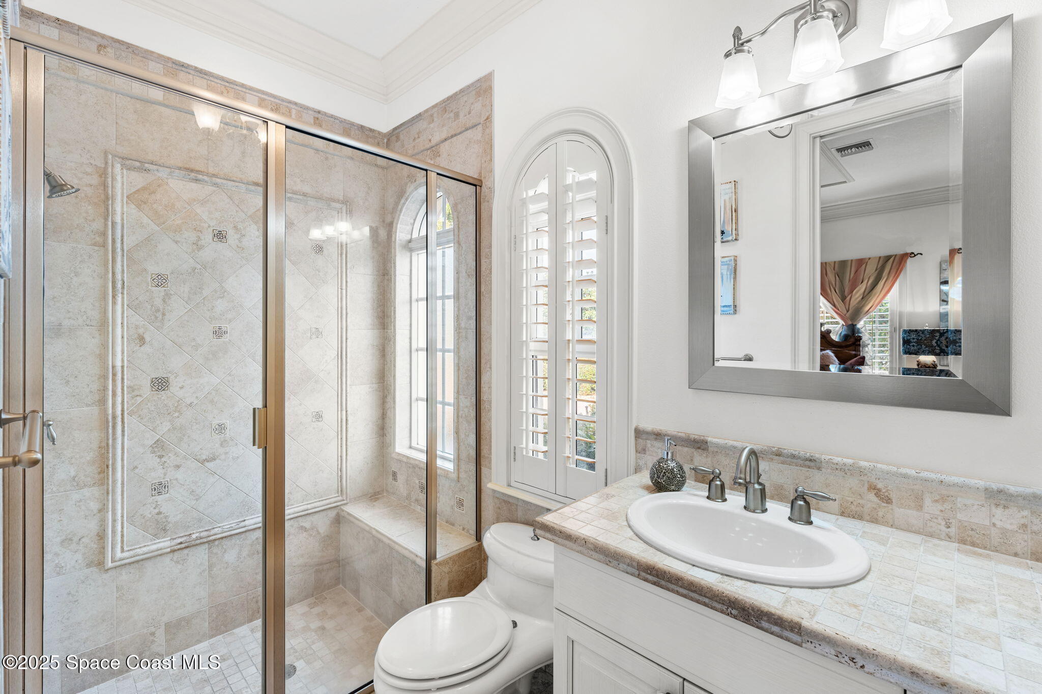 3738 Cappio Drive Melbourne, FL 32940 - Photo 41 of 62 a bathroom with a sink a toilet and shower