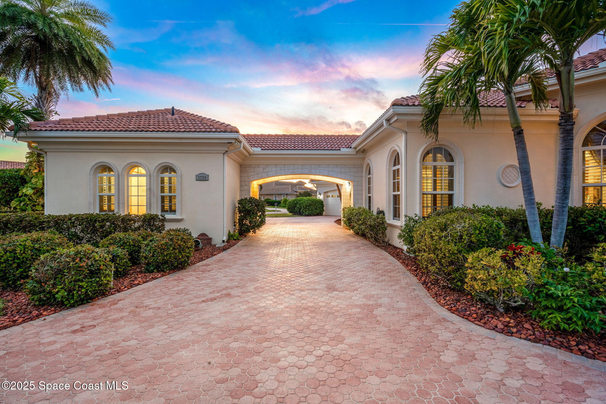 3738 Cappio Drive Melbourne, FL 32940 - Photo 42 of 62 a front view of a house with a garden