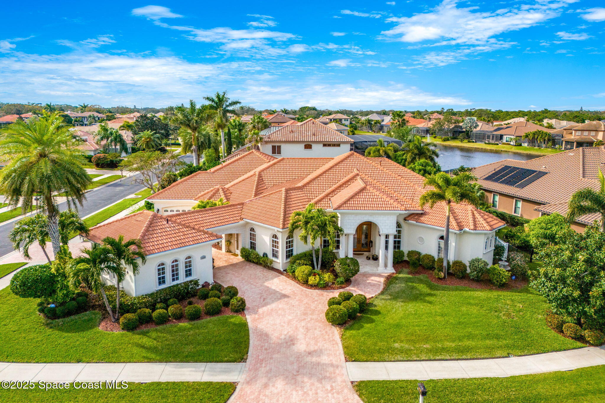 3738 Cappio Drive Melbourne, FL 32940 - Photo 49 of 62 an aerial view of multiple houses with a yard