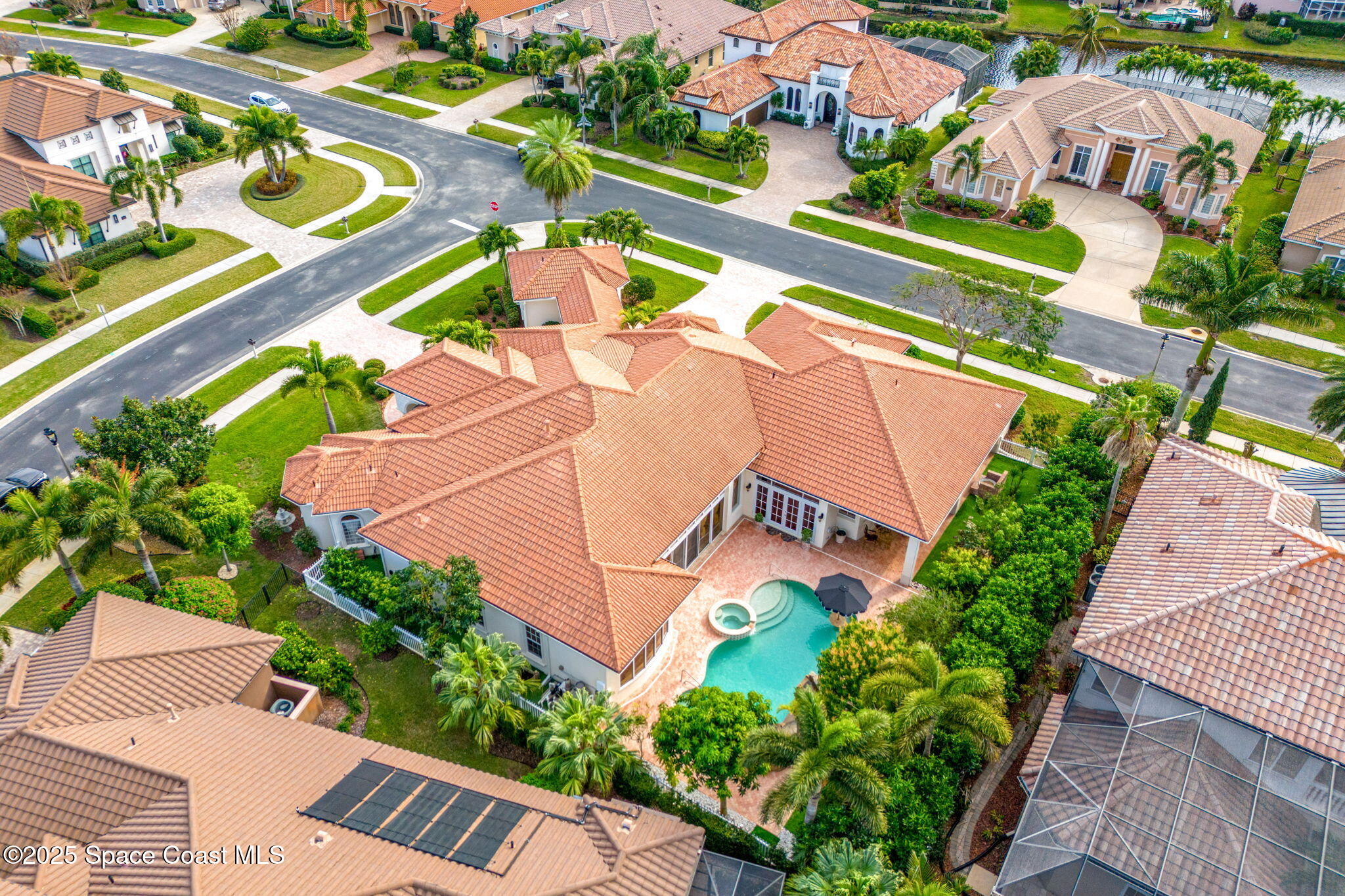 3738 Cappio Drive Melbourne, FL 32940 - Photo 51 of 62 an aerial view of a tennis ground and a cars park side of the road