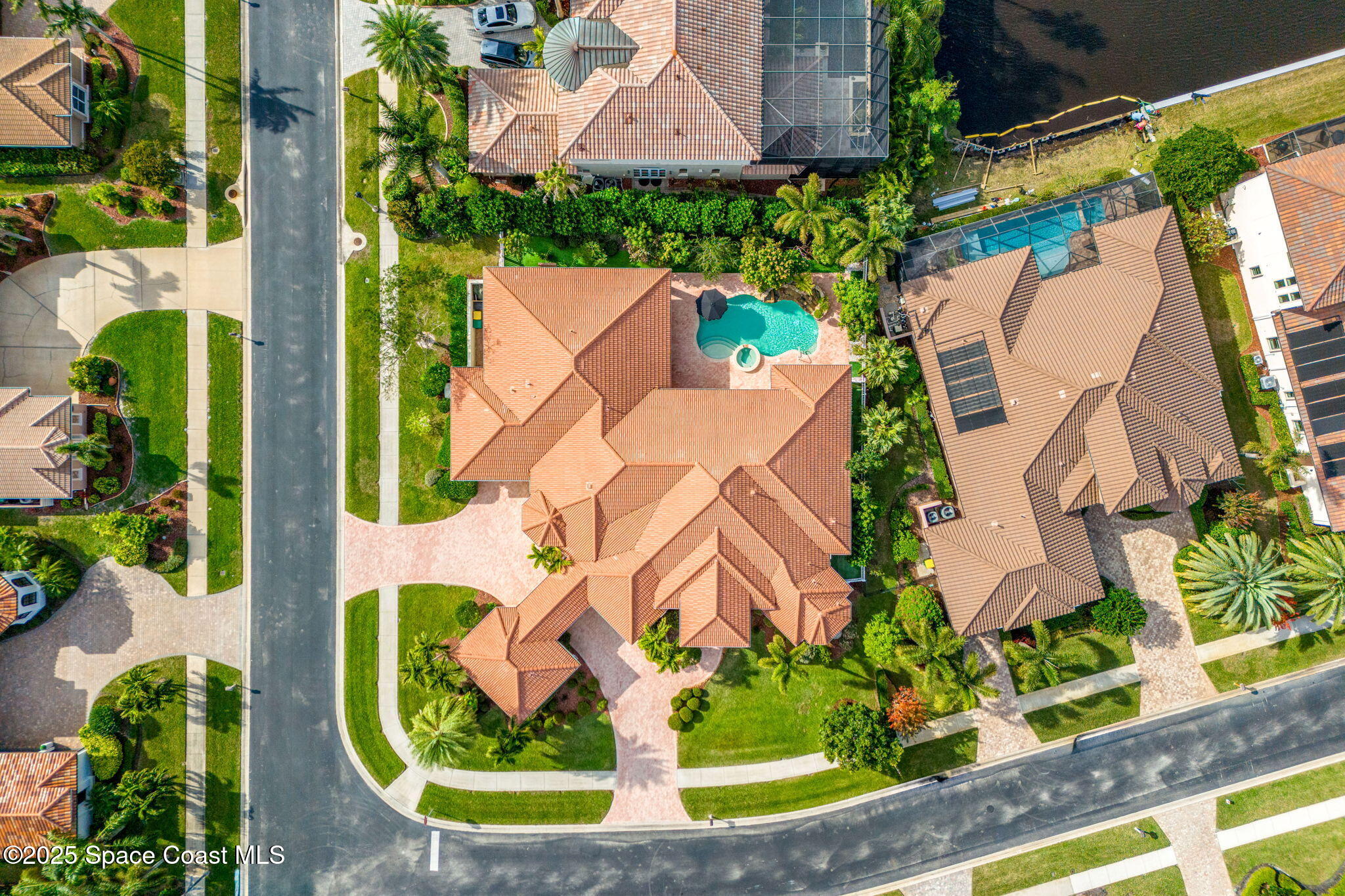3738 Cappio Drive Melbourne, FL 32940 - Photo 55 of 62 an aerial view of a house with a garden and plants