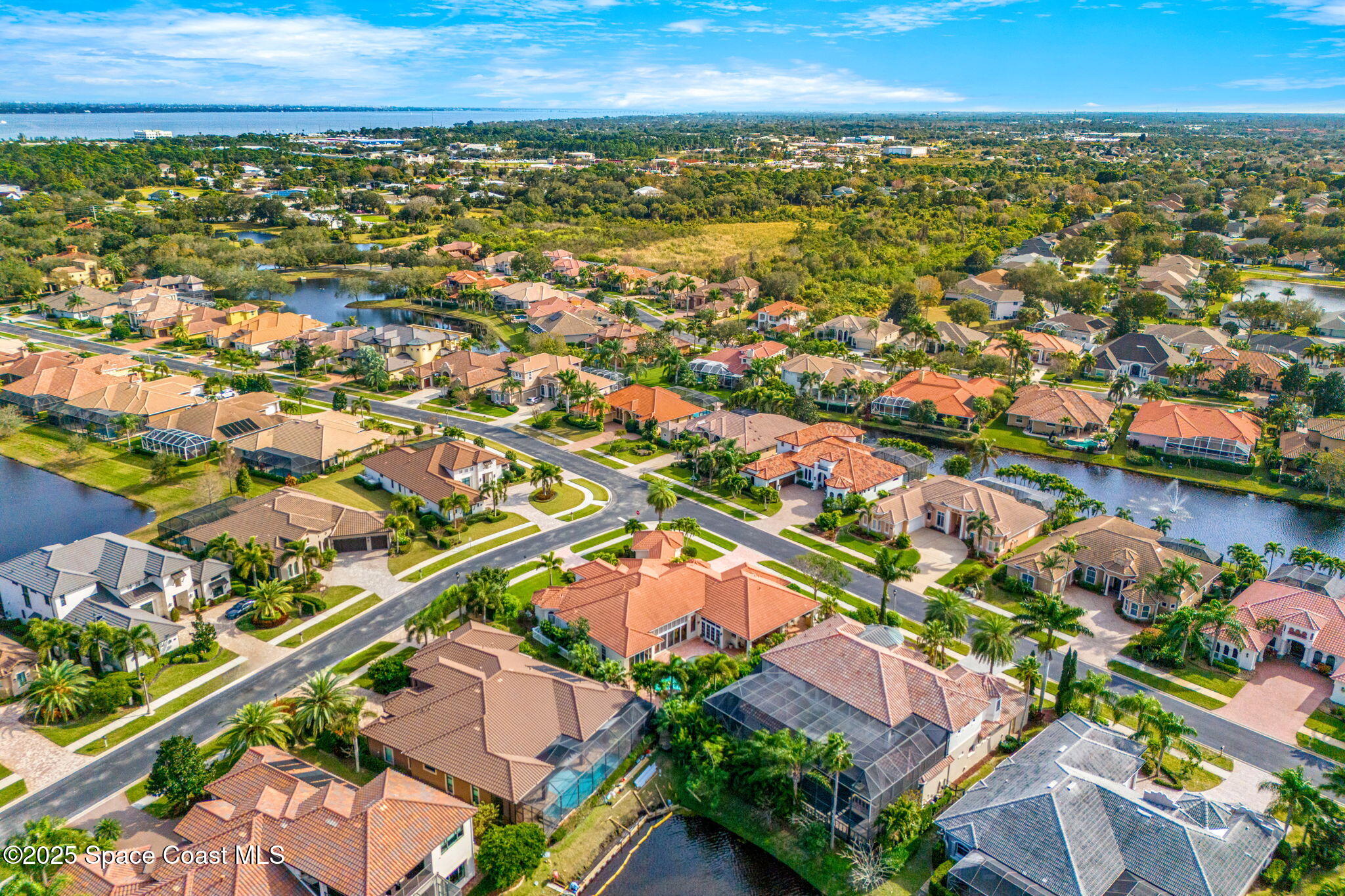 3738 Cappio Drive Melbourne, FL 32940 - Photo 56 of 62 an aerial view of residential houses with outdoor space