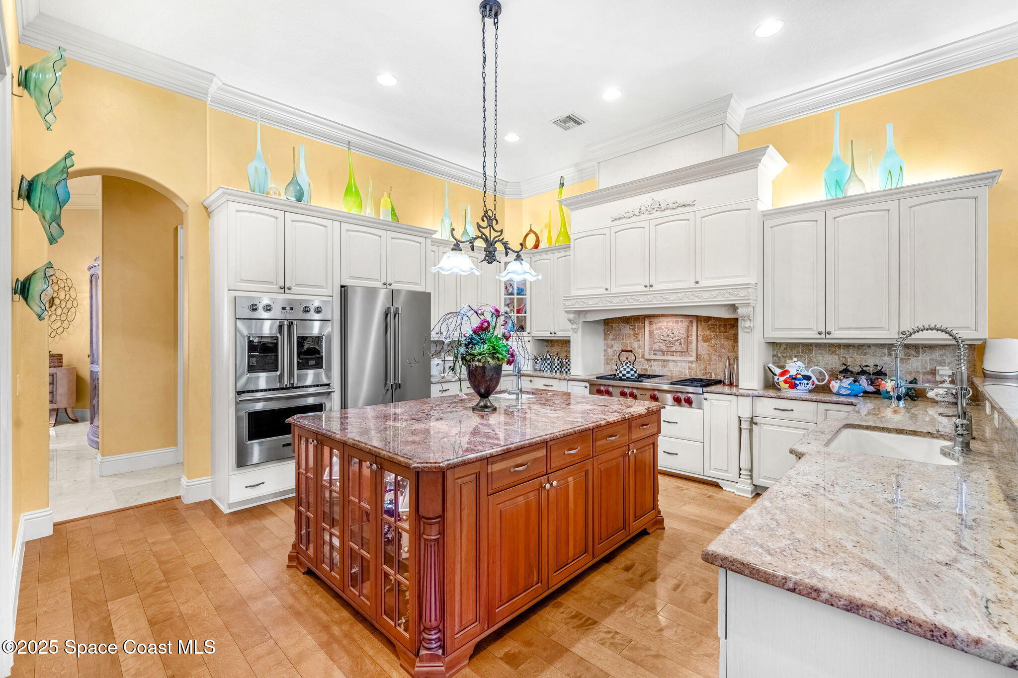 3738 Cappio Drive Melbourne, FL 32940 - Photo 7 of 62 a kitchen with stainless steel appliances granite countertop a stove a sink a refrigerator and a refrigerator