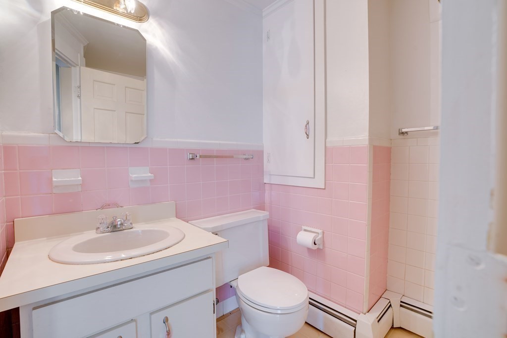 156 Chestnut Street, Unit 6 North Andover, MA 01845 - Photo 14 of 27 a bathroom with a sink toilet and a mirror