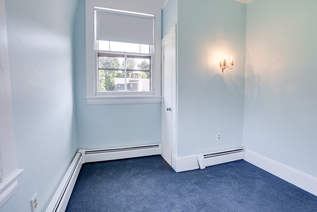 156 Chestnut Street, Unit 6 North Andover, MA 01845 - Photo 17 of 27 an empty room with a window