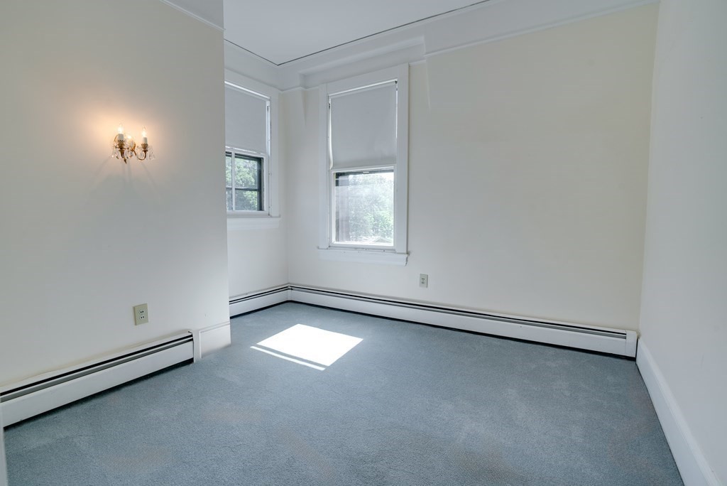 156 Chestnut Street, Unit 6 North Andover, MA 01845 - Photo 18 of 27 an empty room with windows