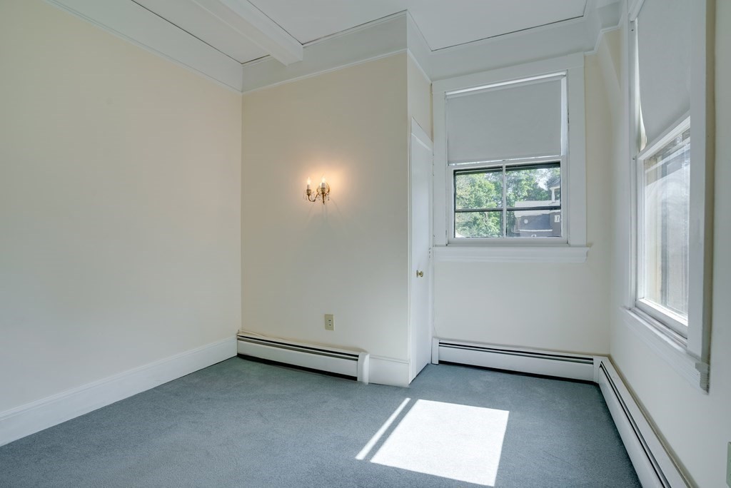 156 Chestnut Street, Unit 6 North Andover, MA 01845 - Photo 19 of 27 an empty room with windows