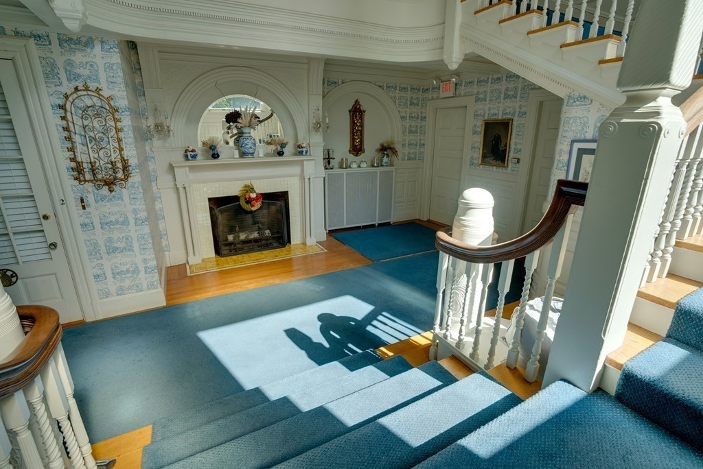 156 Chestnut Street, Unit 6 North Andover, MA 01845 - Photo 21 of 27 a living room with furniture a fireplace and a table