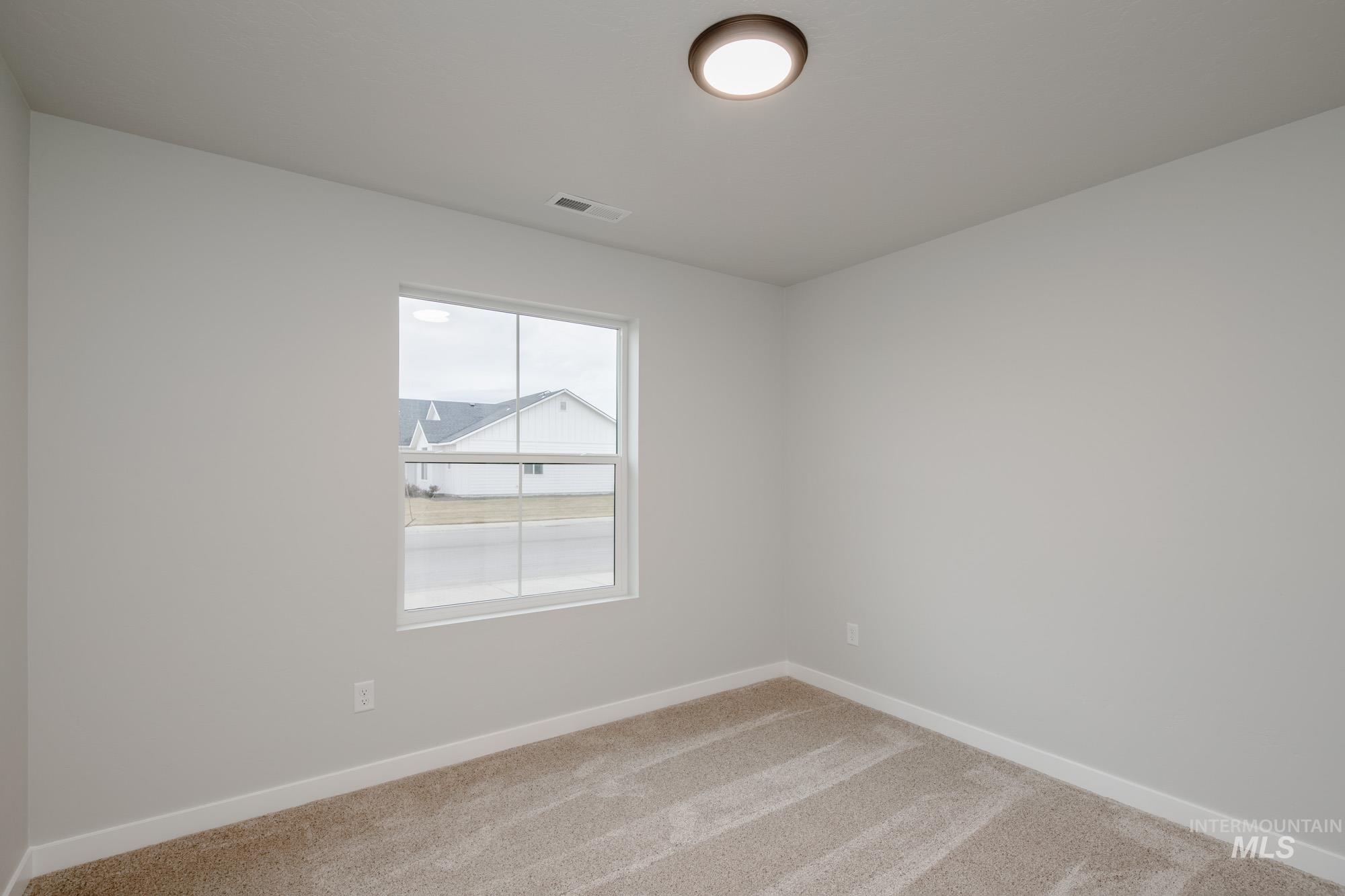 16730 Dunning Way Caldwell, ID 83607 - Photo 13 of 22 Spare room with carpet and baseboards