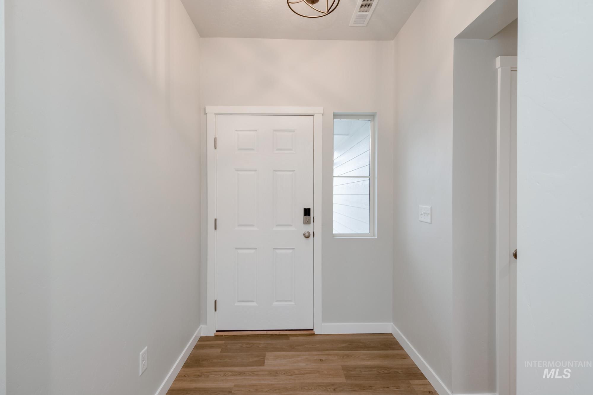 16730 Dunning Way Caldwell, ID 83607 - Photo 2 of 22 Entryway featuring wood finished floors and baseboards