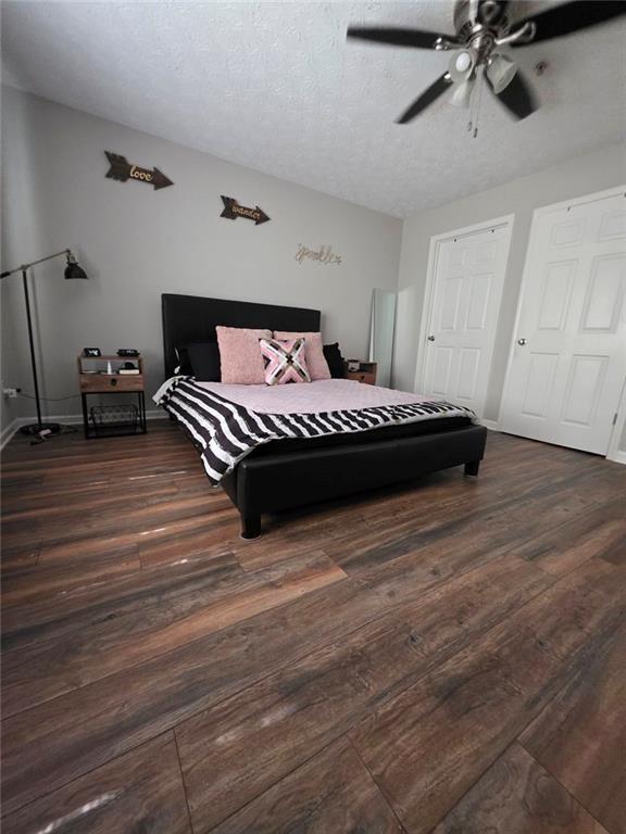 6102 Fairington Ridge Circle Lithonia, GA 30038 - Photo 11 of 22 a bedroom with a bed and wooden floor