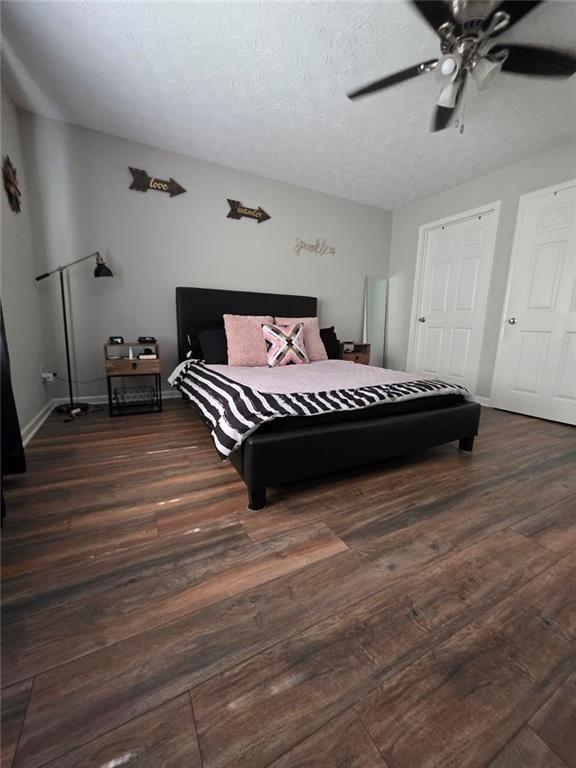 6102 Fairington Ridge Circle Lithonia, GA 30038 - Photo 12 of 22 a bedroom with a bed and wooden floor