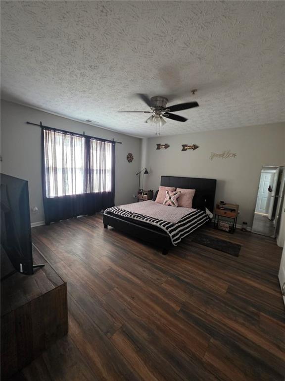 6102 Fairington Ridge Circle Lithonia, GA 30038 - Photo 14 of 22 a bedroom with a bed and wooden floor
