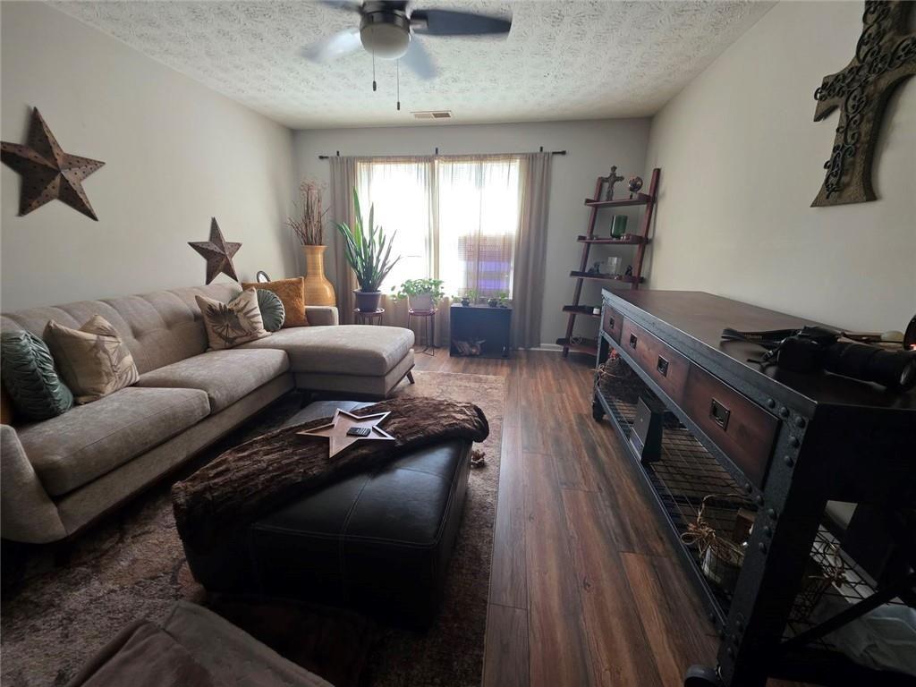 6102 Fairington Ridge Circle Lithonia, GA 30038 - Photo 5 of 22 a living room with furniture and a wooden floor