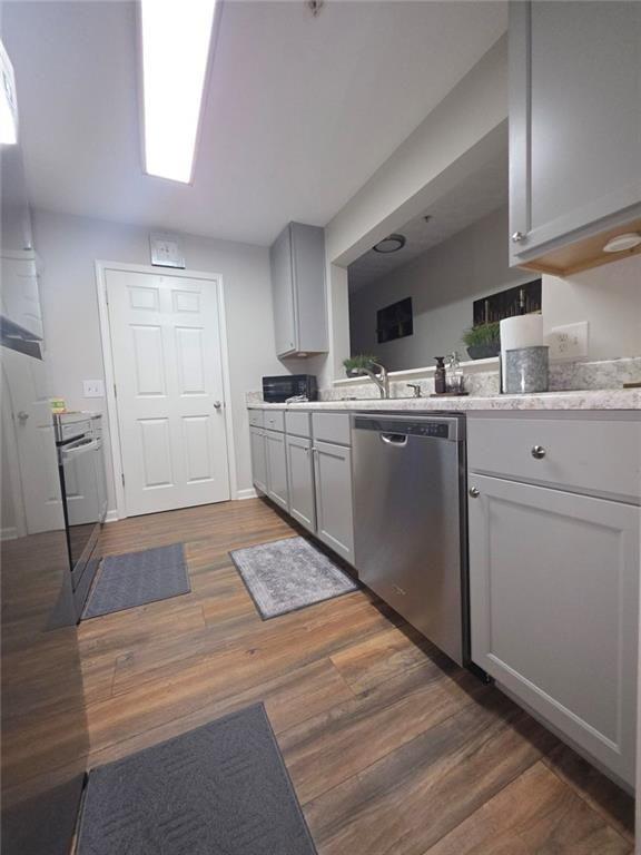 6102 Fairington Ridge Circle Lithonia, GA 30038 - Photo 8 of 22 a kitchen with sink cabinets and wooden floor