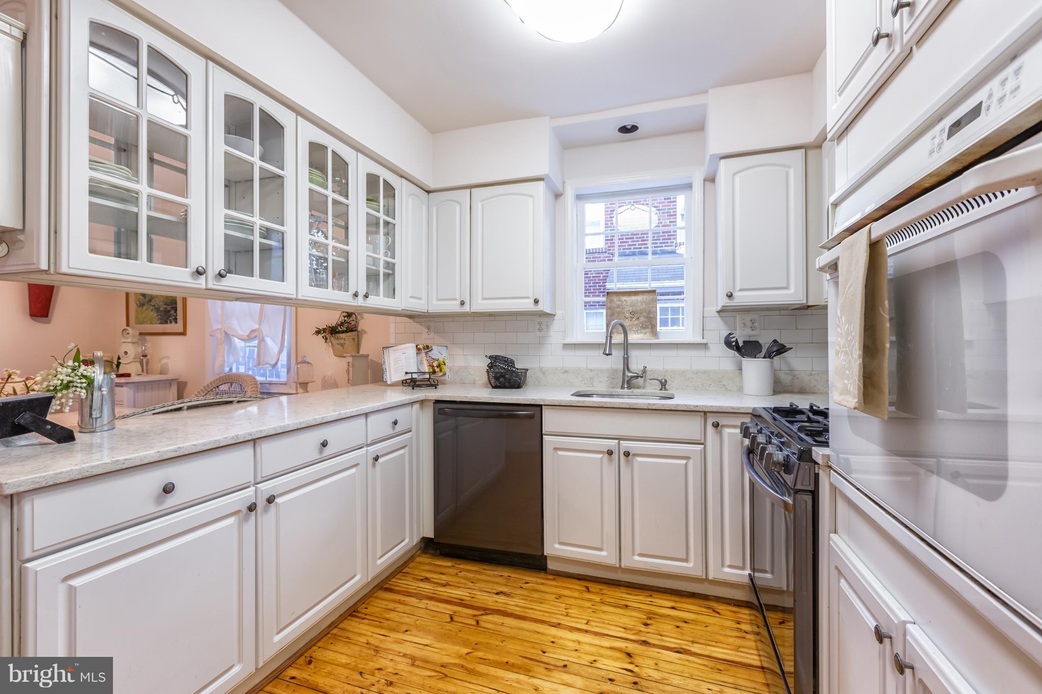5507 Greentree Road Bethesda, MD 20817 - Photo 7 of 30 Bright Kitchen with SS Appliances and Quartz