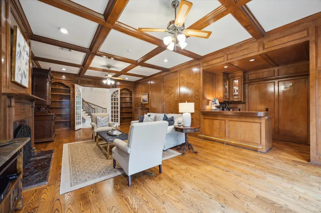 a living room with furniture and kitchen view