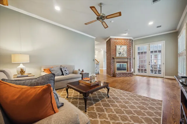 a living room with fireplace furniture and a window