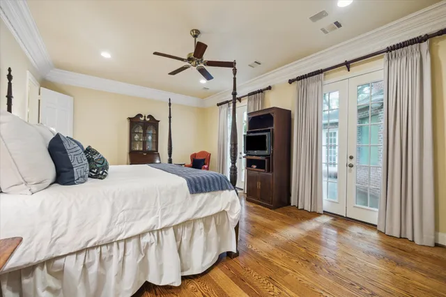 a bed room with a bed and a large mirror