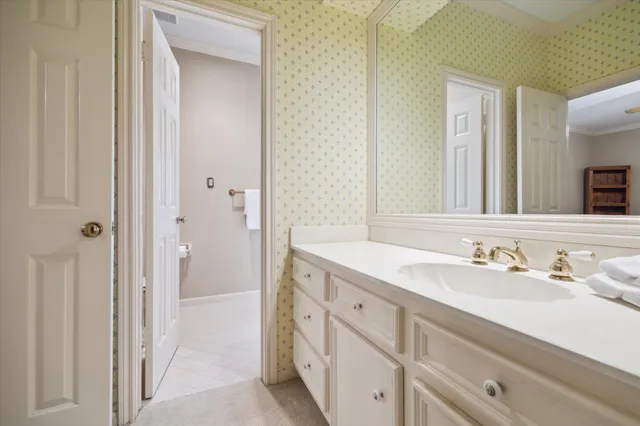 a spacious bathroom with a double vanity sink mirror and