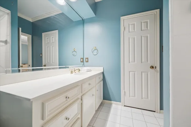 a bathroom with a sink a mirror and a vanity