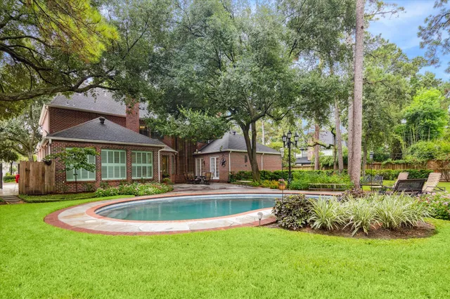 a front view of a house with a yard table and chairs