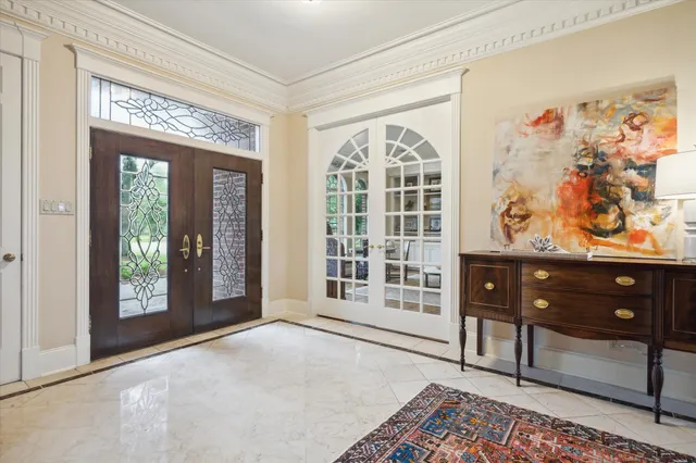 a view of a livingroom with wooden floor and furniture