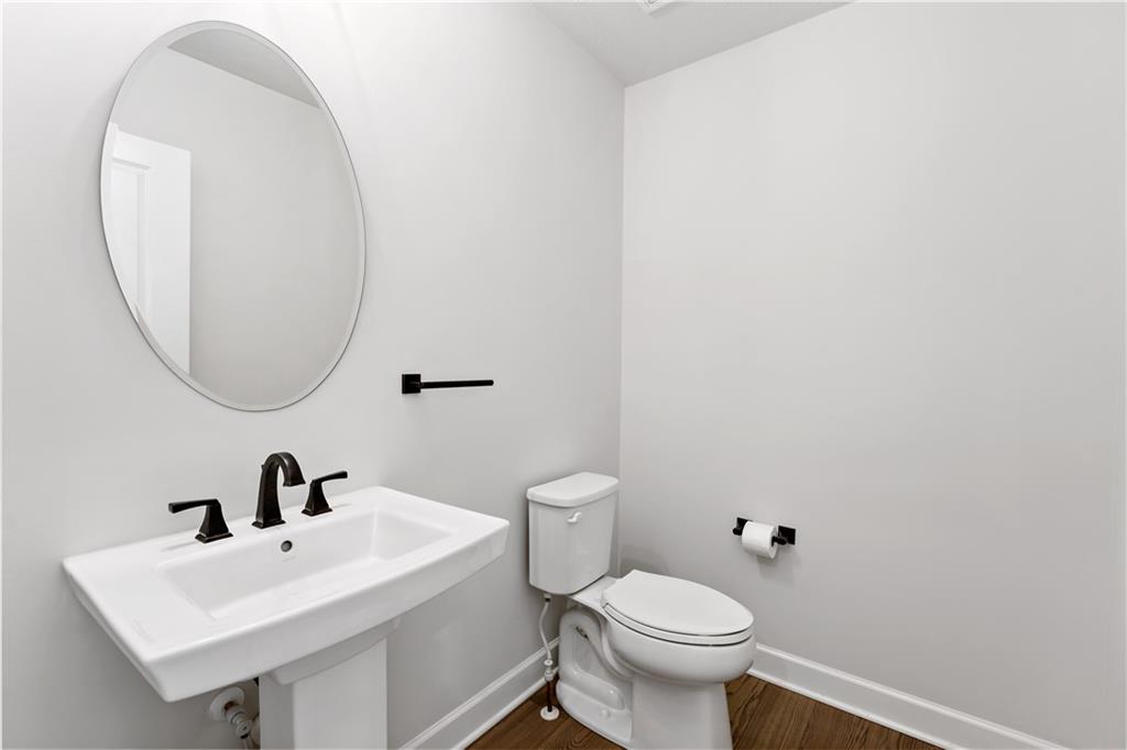 107 Abigail Drive Mars, PA 16046 - Photo 22 of 50 a white toilet sitting next to a bathroom sink