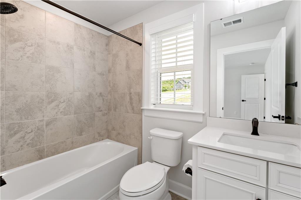 107 Abigail Drive Mars, PA 16046 - Photo 36 of 50 a bathroom with a sink a toilet a bathtub and a shower