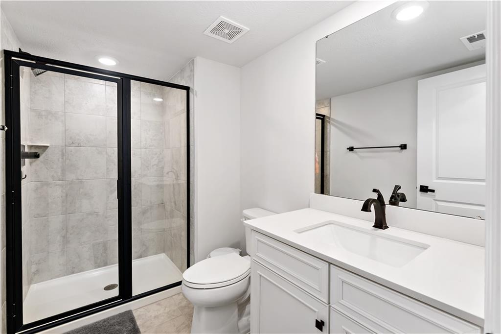 107 Abigail Drive Mars, PA 16046 - Photo 44 of 50 a bathroom with a sink a toilet a mirror and shower