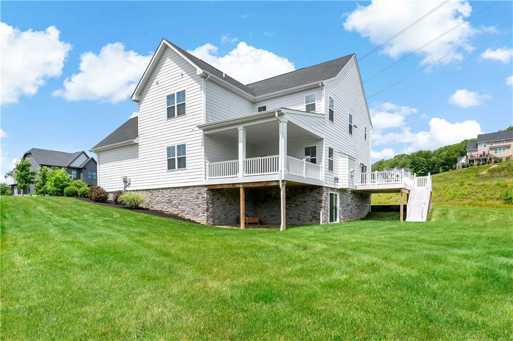 107 Abigail Drive Mars, PA 16046 - Photo 48 of 50 a view of a house with a yard and a large tree