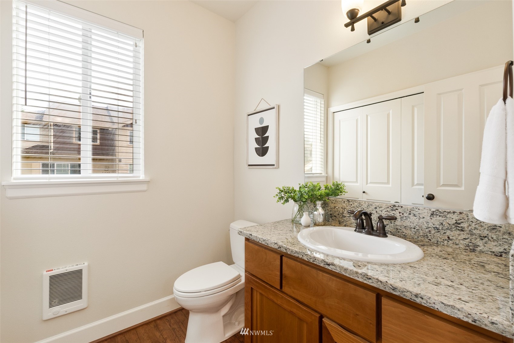 320 Chelan Place Northeast, Unit H4 Renton, WA 98059 - Photo 13 of 25 a bathroom with a granite countertop sink toilet and a mirror