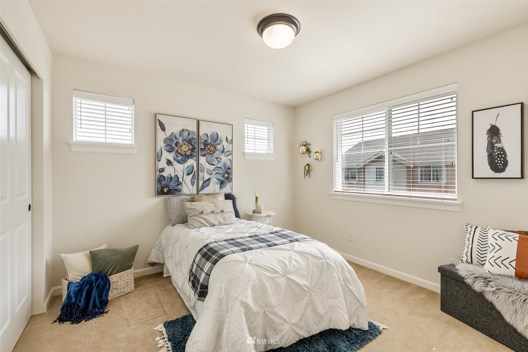 320 Chelan Place Northeast, Unit H4 Renton, WA 98059 - Photo 14 of 25 a bedroom with a bed and wooden floor