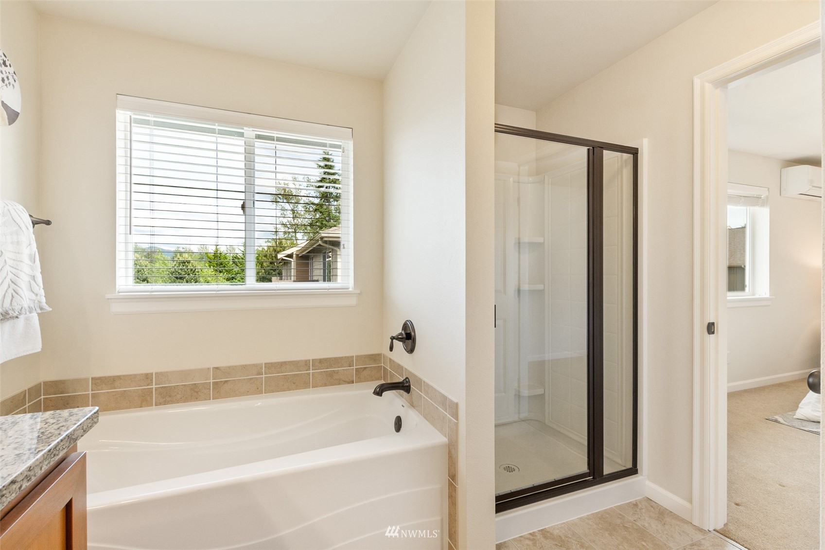 320 Chelan Place Northeast, Unit H4 Renton, WA 98059 - Photo 20 of 25 a bathroom with a bathtub and a shower