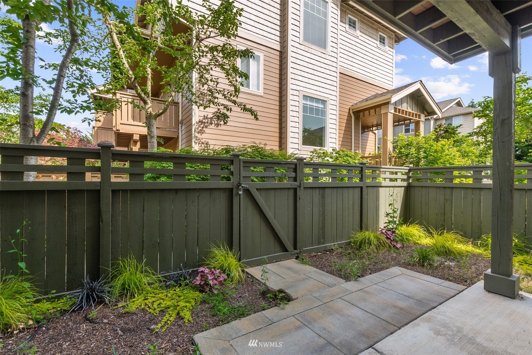 320 Chelan Place Northeast, Unit H4 Renton, WA 98059 - Photo 25 of 25 a house with a garden view
