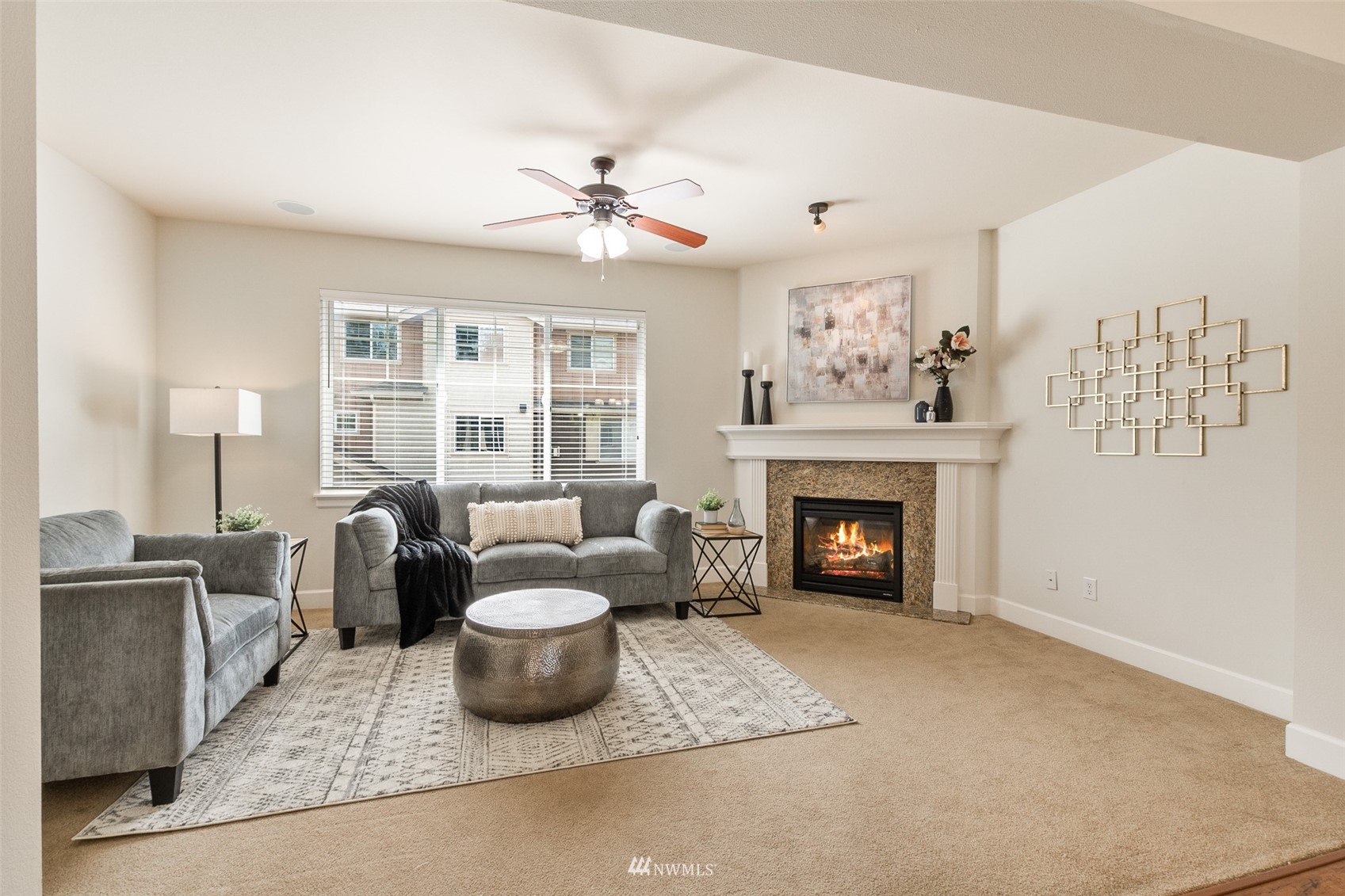 320 Chelan Place Northeast, Unit H4 Renton, WA 98059 - Photo 4 of 25 a living room with furniture and a fireplace