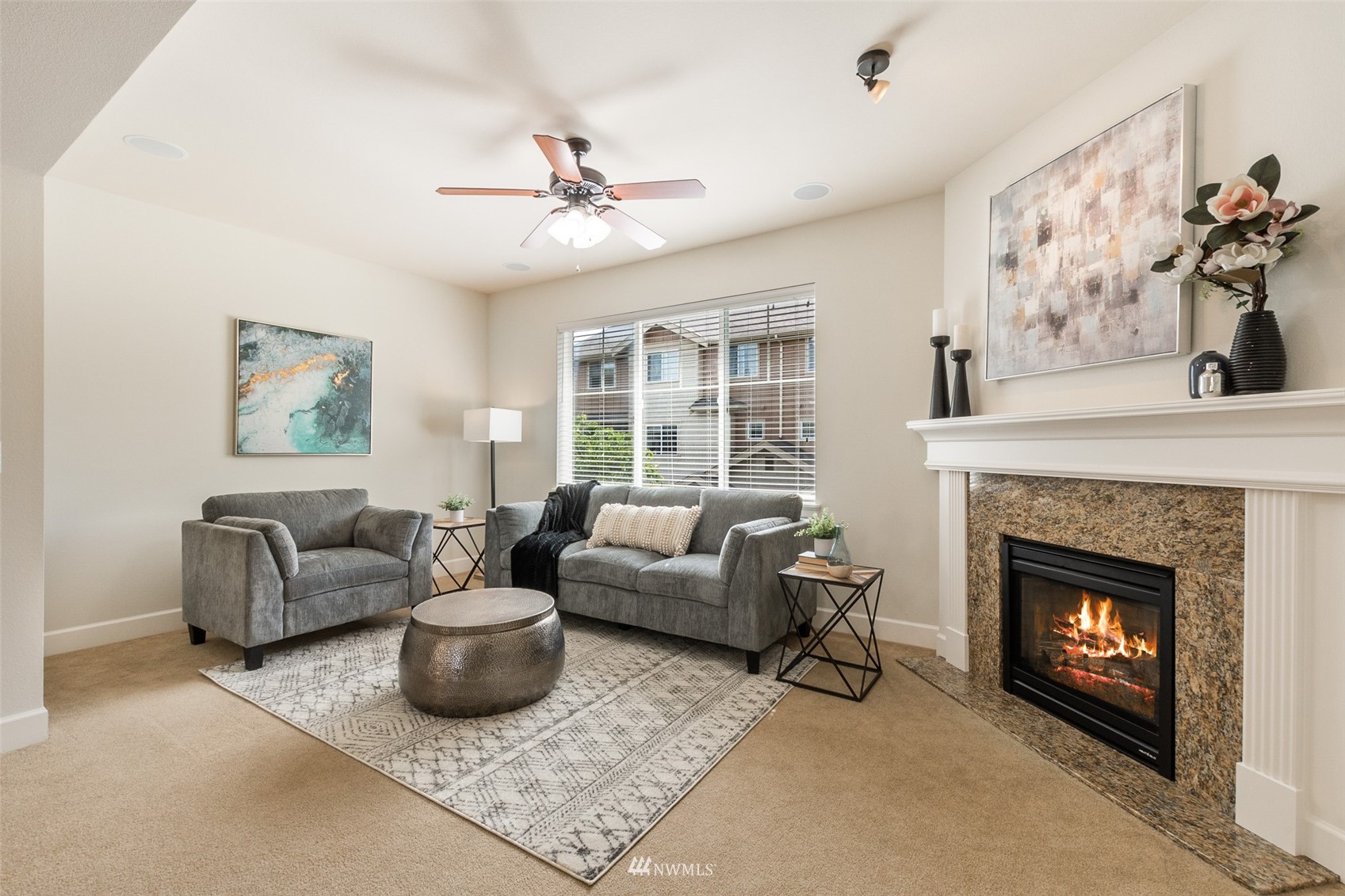 320 Chelan Place Northeast, Unit H4 Renton, WA 98059 - Photo 5 of 25 a living room with furniture and a fireplace
