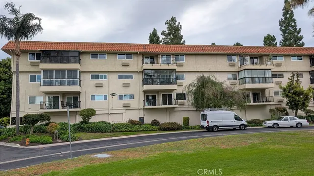 a front view of a house with a yard and sitting area